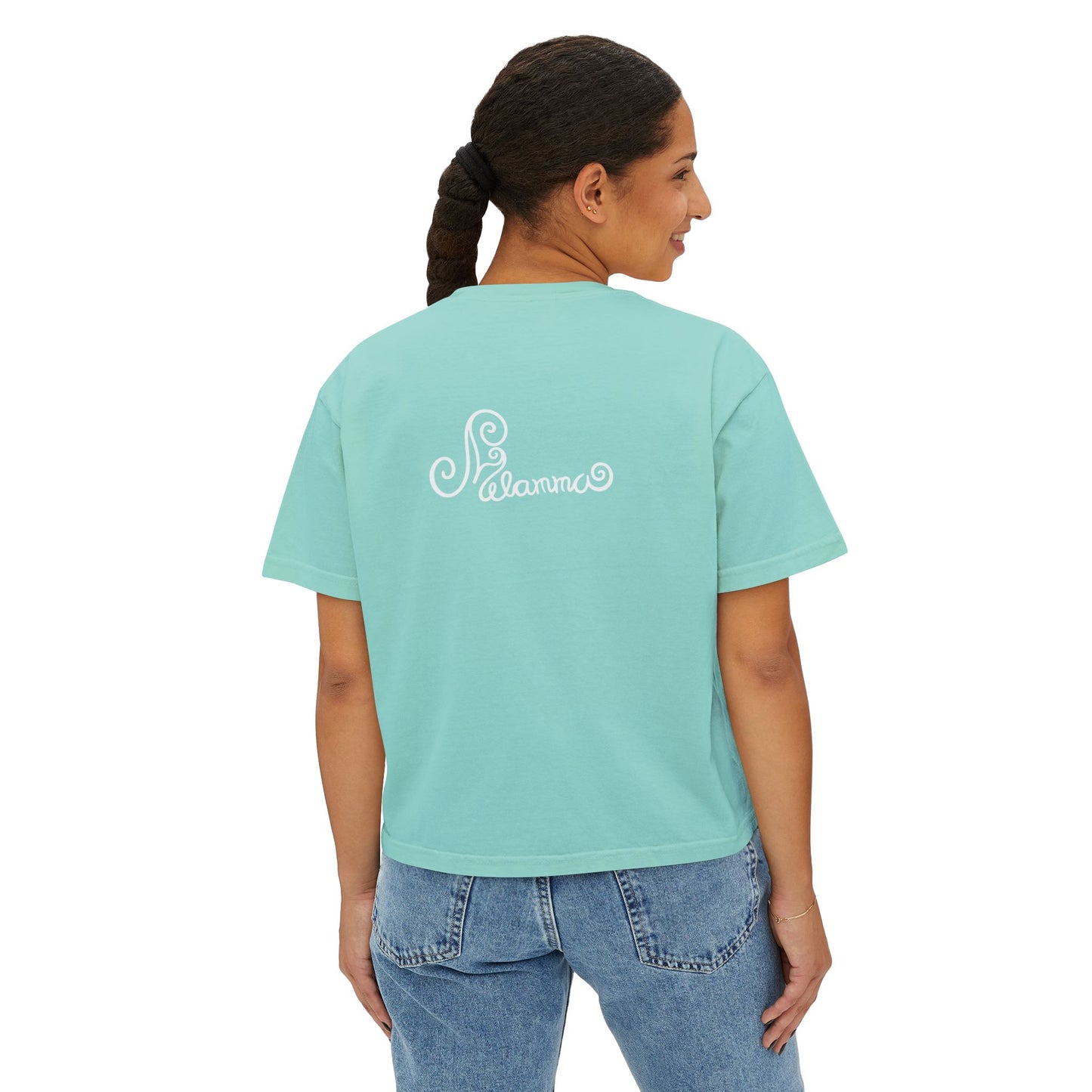 Melammu 8-point star boxy tee in chalky mint — red 8-point star on a light blue circle with yellow centre on the front, white Melammu logo on back