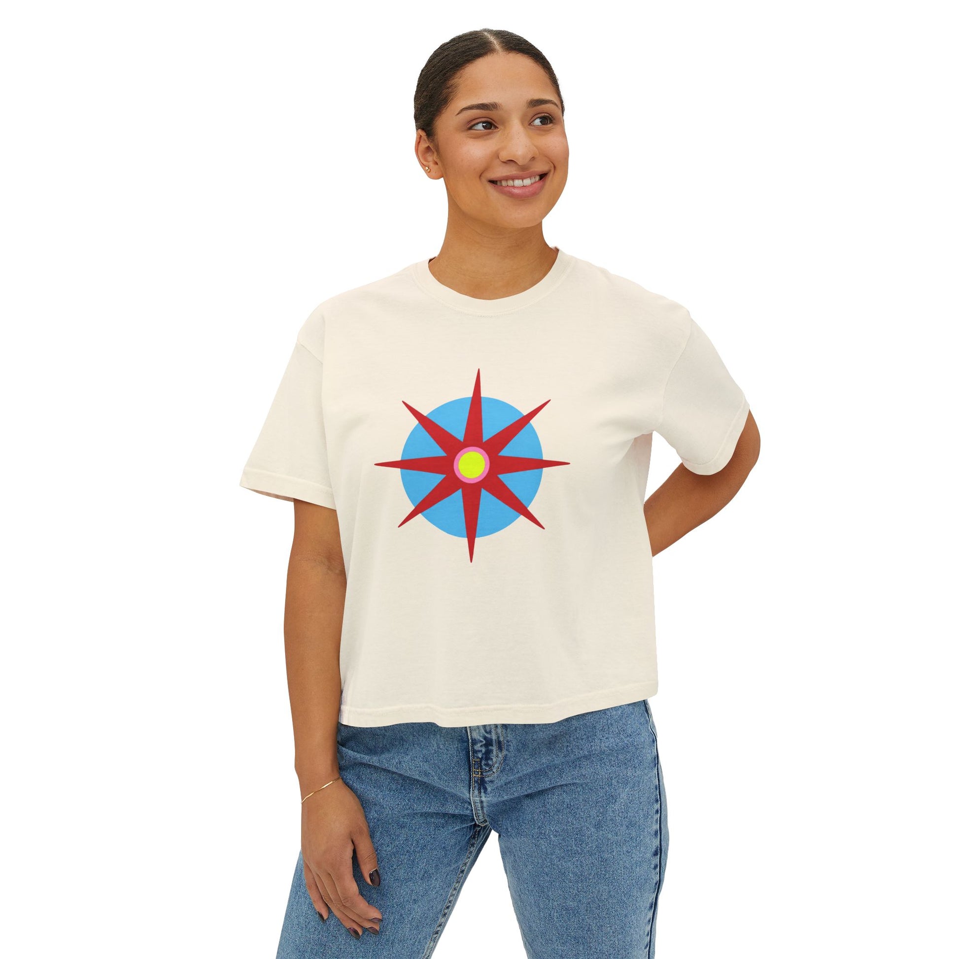Melammu 8-point star boxy tee in Ivory — red 8-point star on a light blue circle with yellow centre, navy Melammu logo on back