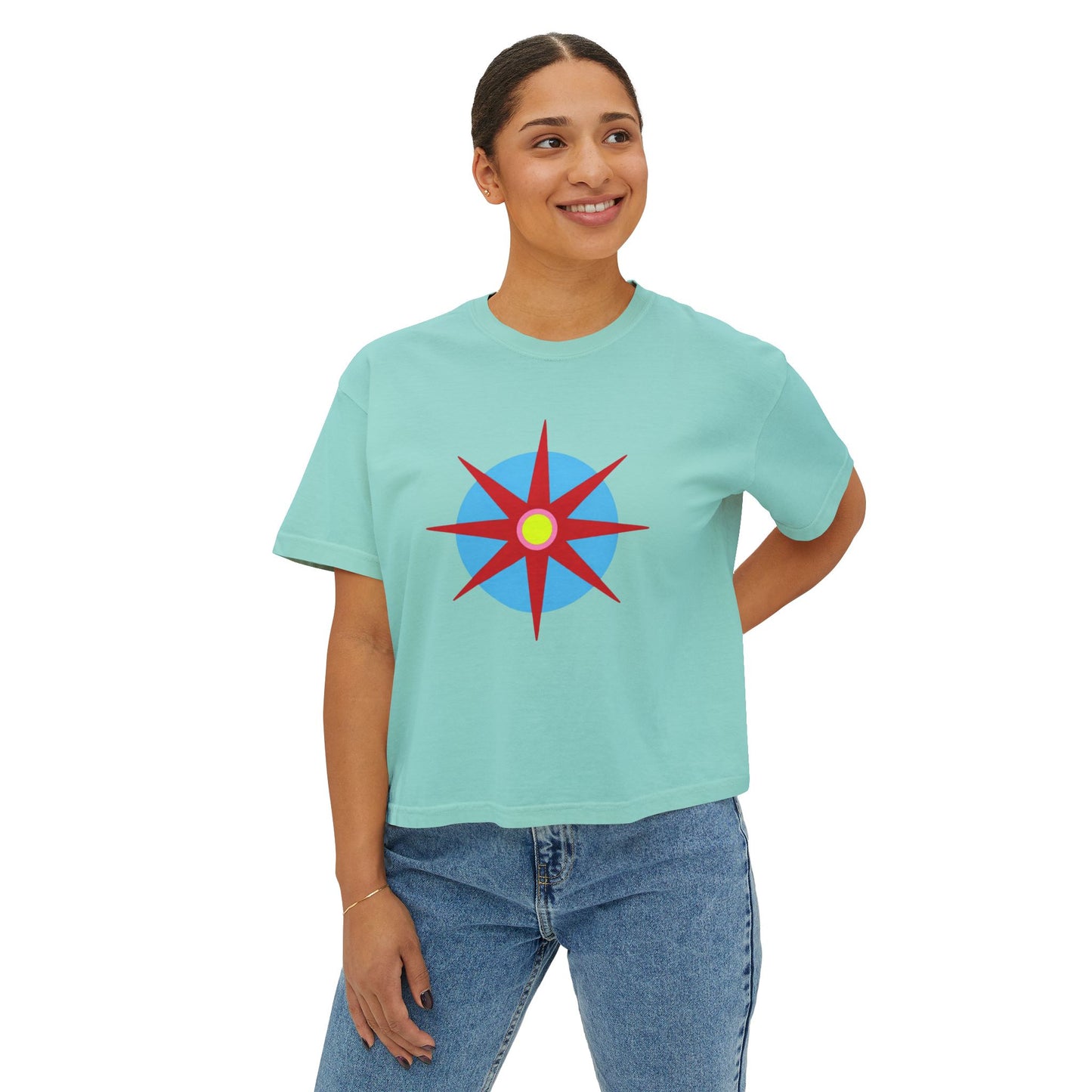 Melammu 8-point star boxy tee in chalky mint — red 8-point star on a light blue circle with yellow centre on the front, white Melammu logo on back