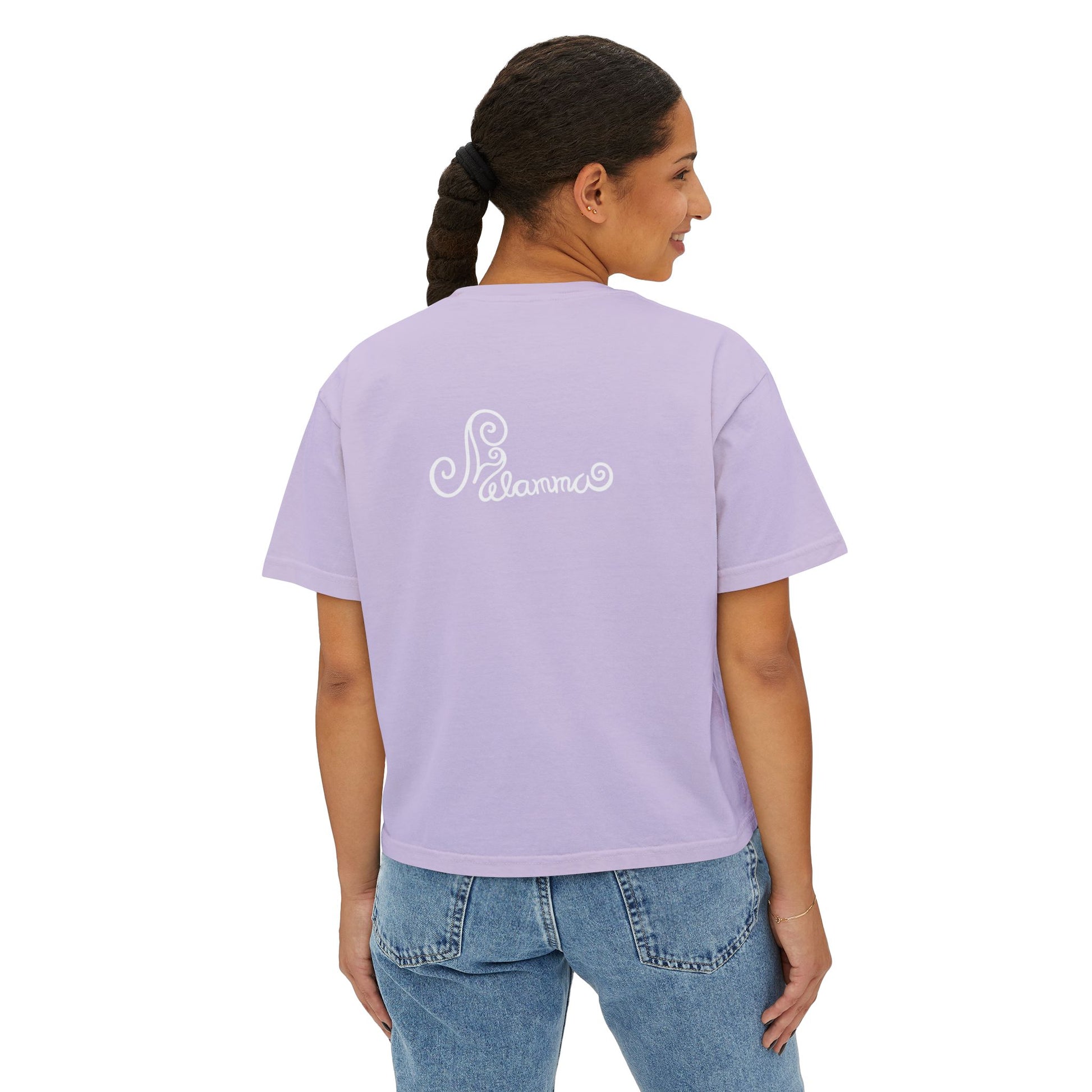 Melammu 8-point star boxy tee in lilac — red 8-point star on a light blue circle with yellow centre on the front, white Melammu logo on back